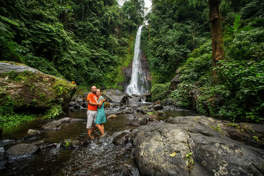 Couple near Gitgit waterfall on Bali in indonesia