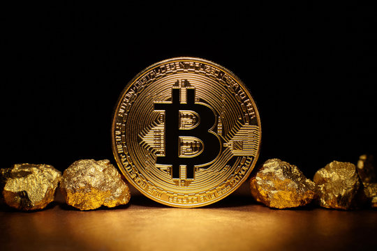 Golden Bitcoin Coin and mound of gold