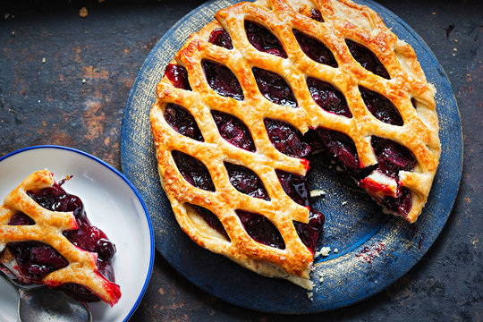 Lattice autumn fruit pie, with blackcurrant, blackberry, cherry compote in puff pastry pie 