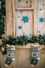 Fototapeta na wymiar blue-white socks with reindeer for Christmas gifts