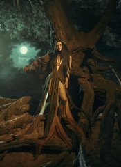 A fabulous, forest nymph with long hair stands in the roots of a tree in the moonlight. Background dark night and fog. Mythical character of Gyana