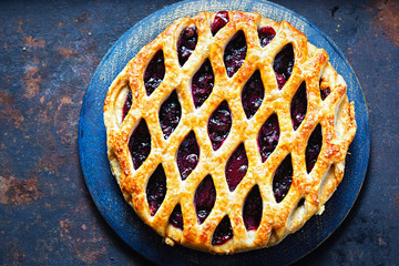 Lattice autumn fruit pie, with blackcurrant, blackberry, cherry compote in puff pastry pie 
