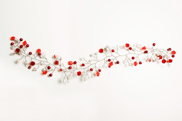Nice hair accessory with white and red beads over a white background