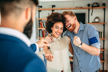 Young couple buying their new home