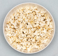 Popcorn viewed from above on blue background. Top view