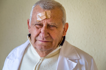 doctor with patches on the forehead