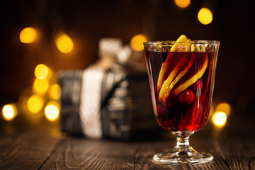 Hot wine with spices in Christmas arrangement