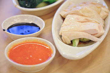 Delicious legendary Singaporean Hainanese chicken rice with two