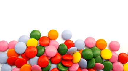Colorful chocolate candies on white background
