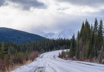 Fototapeta na wymiar Winter road in the mountains, Kananaskis, Alberta, Canada