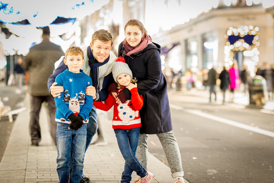 Happy Family On Regent's Street In Christmas Time, London