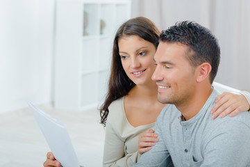 couple reading a letter