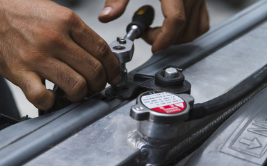 Fixing automotive engine, reparing the car.