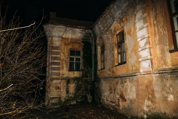 Fototapeta na wymiar Old creepy abandoned haunted mansion, eerie house, horror atmosphere