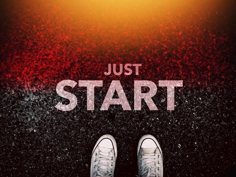 Just start word and sneakers shoes on grunge road and light effect