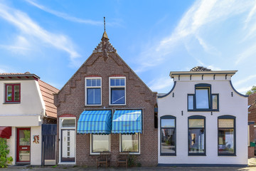 Street view with typical houses and architecture in Den Burg, village on the wadden island Texel.