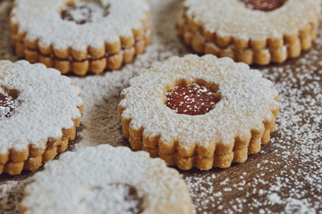 Close up of freshly baked homemade Christmas sugar cookies with jam