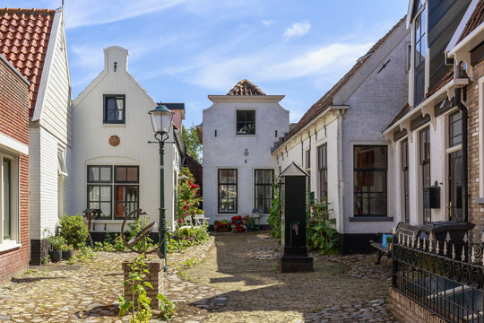 Street view with typical houses and architecture in Den Burg, village on the wadden island Texel.
