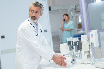 doctor washing hands before operation