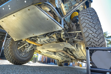 Chassis off road vehicle in the parking lot up on block to show mechanics © Jason