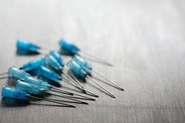 Ampoule and needles from a medical syringe