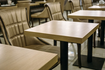 Empty coffee room with tables and chairs