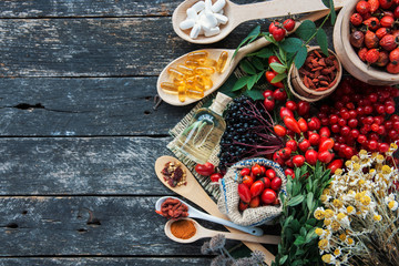 Medicinal tablets and pills and herbs composition: Dog rose, bunch branch Rosehips, types Rosa canina hips, essential oil. bunch, dried flowers of linden and chamomile elderberries and goji berries 