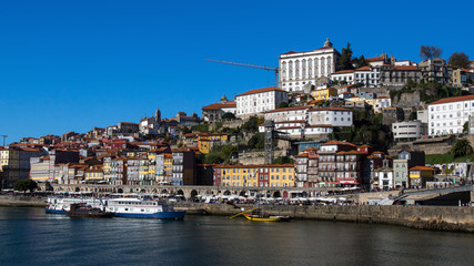 Fototapeta na wymiar Ribeiro embankment on the Douro river, Porto, Portugal.