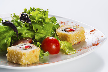 Salad vegetable and sushi rolls