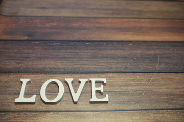 word Love from wooden letters on background