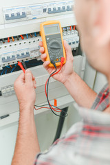 Electrician using a device