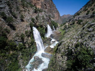 Fototapeta na wymiar Mountain forest waterfall landscape. Kapuzbasi waterfall in Kayseri, Turkey