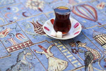 Turkish tea in traditional glass. Close up shot. Copy space for text