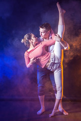 Fototapeta premium The girl on the twine. The girl with the guys on the twine. Dance of boys and girls.