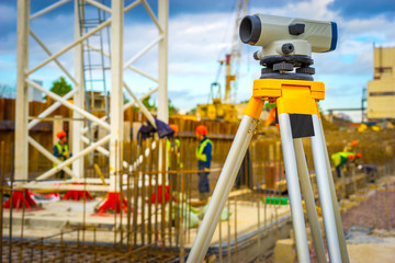 Geodetic measurements on the construction site. Theodolite at the construction site.