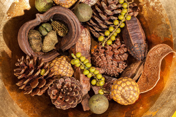 Christmas potpourri table decoration. Traditional xmas pinecone and berries.