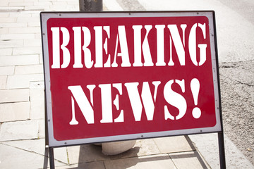 Naklejka premium Conceptual hand writing text caption inspiration showing Breaking News. Business concept for Newspaper Breaking News written on old announcement road sign with background and copy space