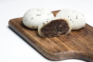 Glutinous rice cake on wood cutting board ; white background