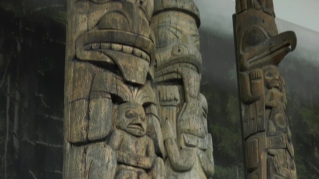 totem pole close up pan from bottom to top in museum native indian displays 4k