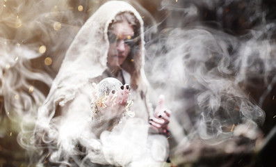 Fairy magician. A sorcerer with a glass sphere, a magical spell 