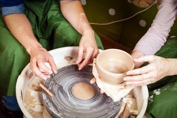 Close-up of a  woman potter sclulpt clay