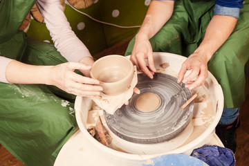 Close-up of a  woman potter sclulpt clay