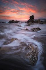 Seascape at sunset taken with long exposure to make slow movement