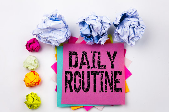 Writing text showing Daily Routine written on sticky note in office with screw paper balls. Business concept for Accuracy Procedure on the white isolated background.