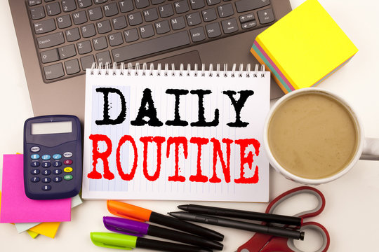 Word writing Daily Routine in the office with surroundings such as laptop marker pen stationery coffee Business concept for Accuracy Procedure Workshop background with copy space