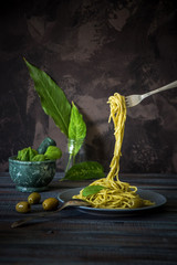 Spaghetti with pesto sauce. Italian traditional dish