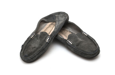 worn out female shoes on white isolated background