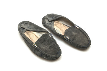 worn out female shoes on white isolated background