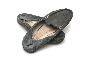 worn out female shoes on white isolated background