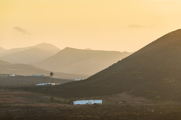 Incredible volcanic landscape of Lanzarote at sunset. Canary Islands. Spain.